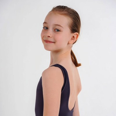 Girl in purple leotard profile view