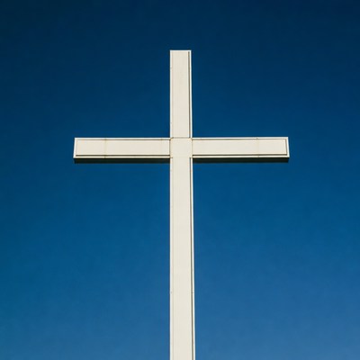 White Cross Against Blue Sky