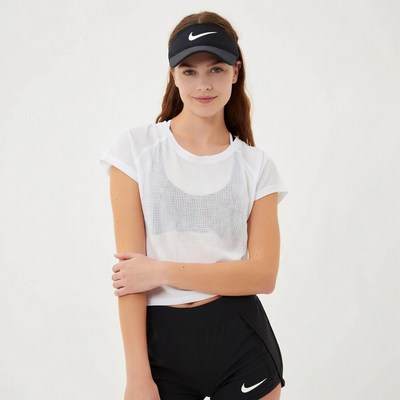 Woman in Nike visor and athletic wear