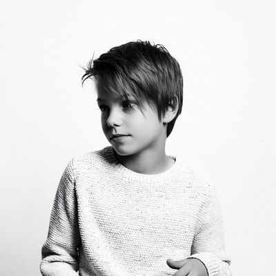 Boy in sweater profile view