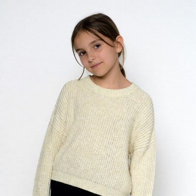 Girl smiling in cream knit sweater