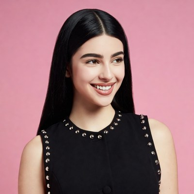 Smiling woman in black studded top