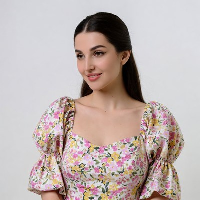 Woman in pink floral puff sleeve dress