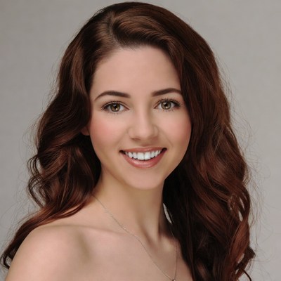 Smiling woman with long red hair