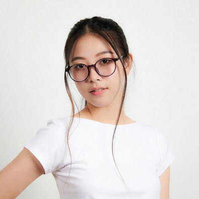 Asian woman in glasses wearing white shirt