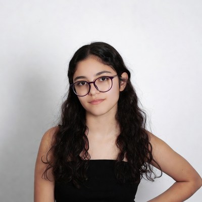 Young Latina woman with glasses smiling