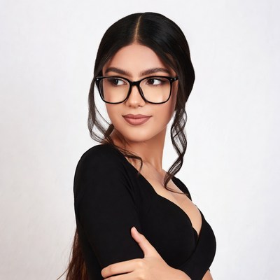 Woman in black dress with glasses