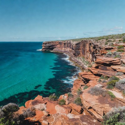 Red Cliffs Over Turquoise Ocean
