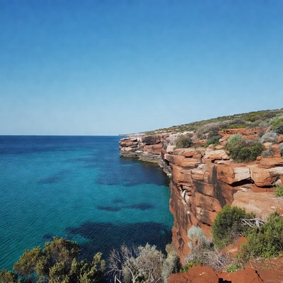 Red Cliffs Over Turquoise Ocean