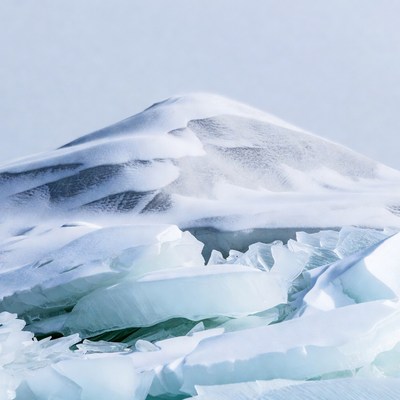Snow-Covered Mountain with Ice Chunks