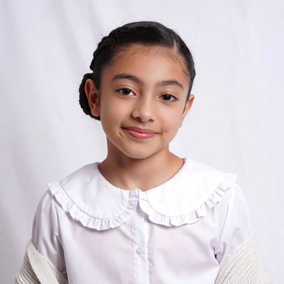 Asian girl smiling in white collared blouse