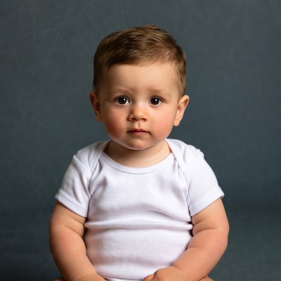 Baby boy in white onesie