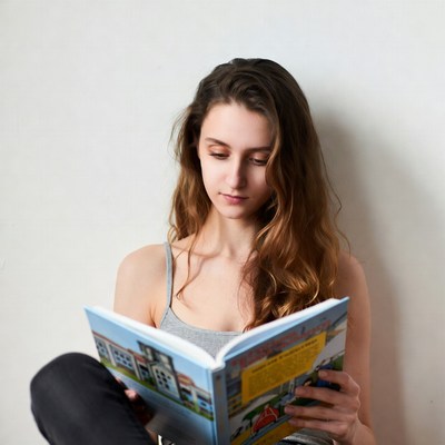 Young woman reading book