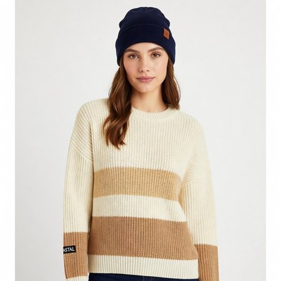 Woman in navy beanie and cream sweater