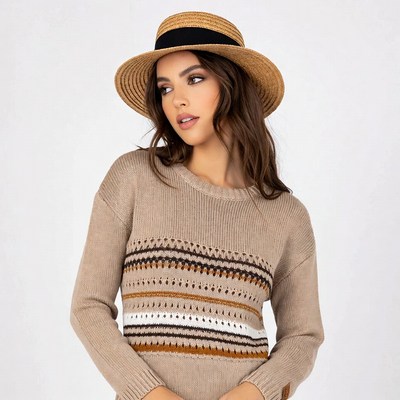 Woman wearing straw hat and sweater