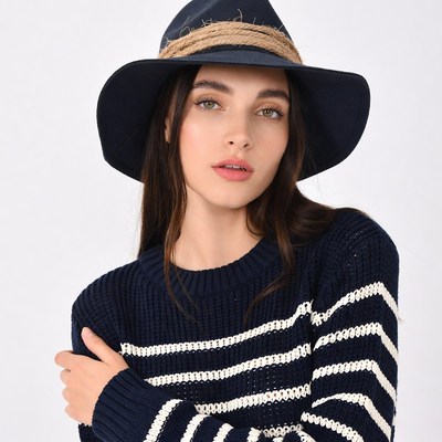 Woman wearing black straw hat