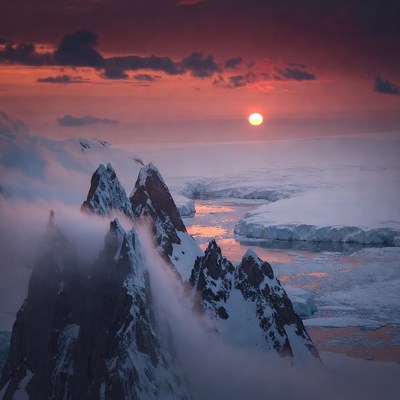 Sunset over Antarctic Iceberg Mountains