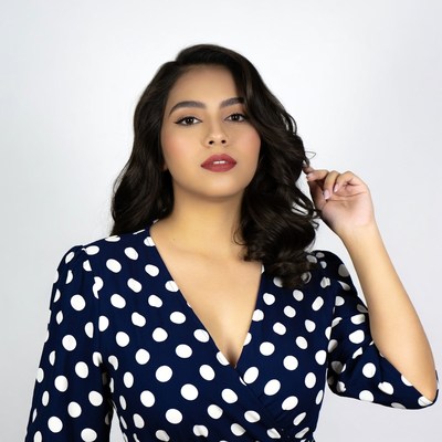 Asian woman in polka dot dress
