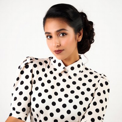 Indian woman in polka dot blouse