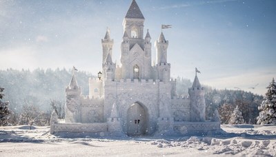 Snow sculpture castle in winter landscape