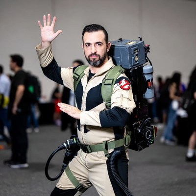 Man waving in Ghostbusters cosplay