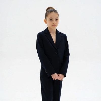 Young girl in black blazer suit