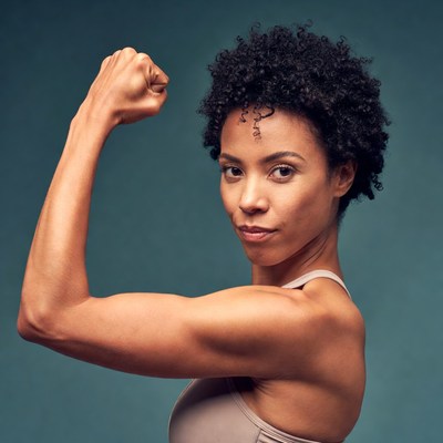 African-American woman flexing bicep