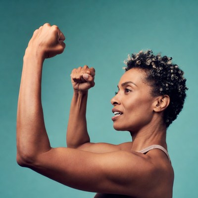 African-American woman flexing muscles