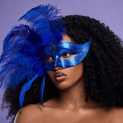 African-American woman in blue feathered mask