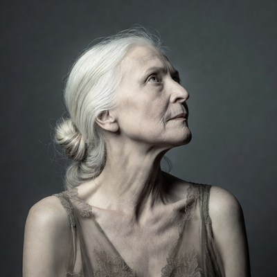 Elderly woman with white hair profile