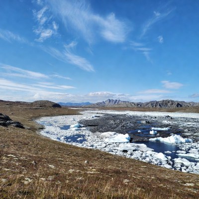 Glacial Lagoon with Icebergs in Mountains