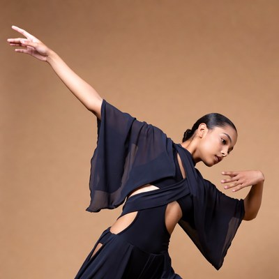Black woman dancing in flowing black dress