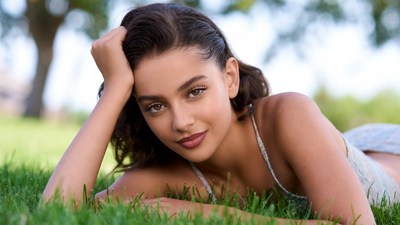 Beautiful woman lying on grass