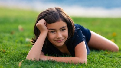 Girl smiling on grass