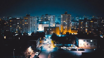 Night cityscape with lit skyscrapers