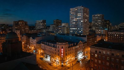 Lit Hotel in Nighttime Cityscape