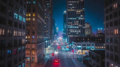 Neon-lit city street at night