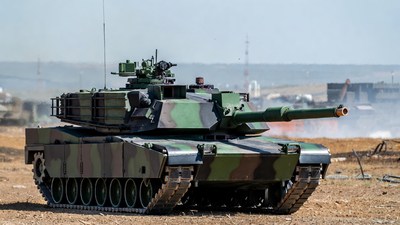 M1 Abrams tank firing in desert