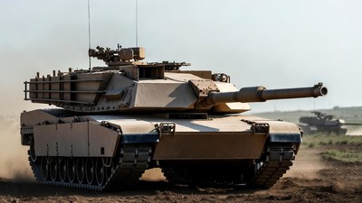 M1 Abrams tank driving in desert