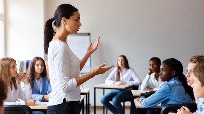 Female teacher teaching diverse students