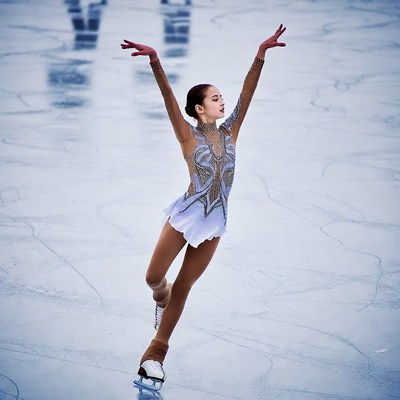 Asian girl figure skating on ice