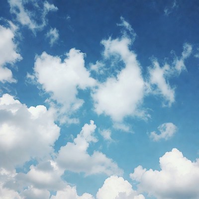 Fluffy White Clouds in Blue Sky