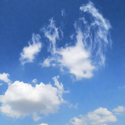 Fluffy white clouds in blue sky
