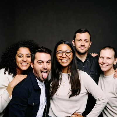 Diverse group smiling with tongue out