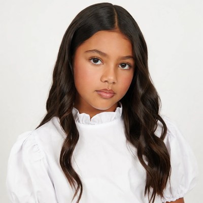 Latino girl in white ruffled blouse