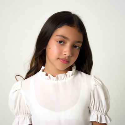 Asian girl in white ruffled blouse