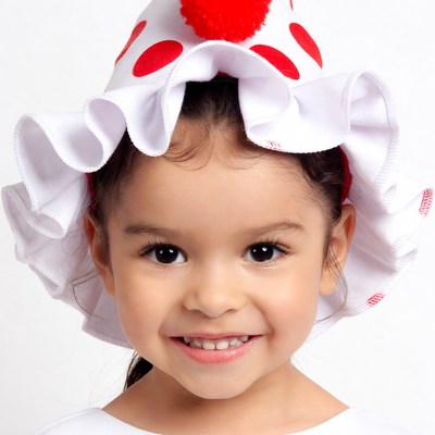 Smiling girl in clown hat