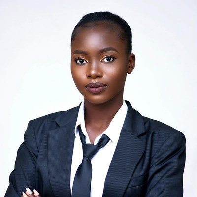 African woman in suit with arms crossed