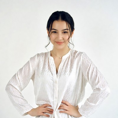 Asian woman hands on hips smiling