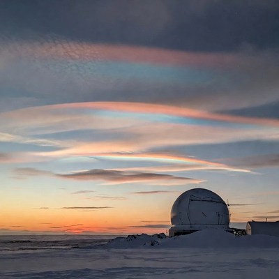 Radar Dome with Sun Dogs over Snowy Landscape